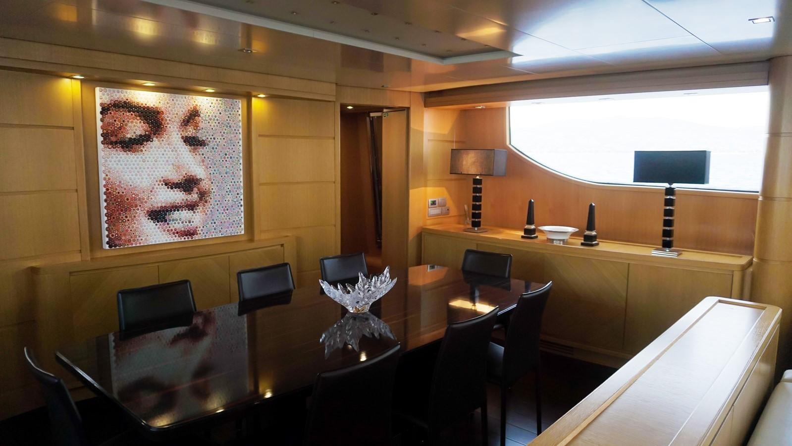 a room with a large painting on the wall aboard PETRUS Yacht for Sale
