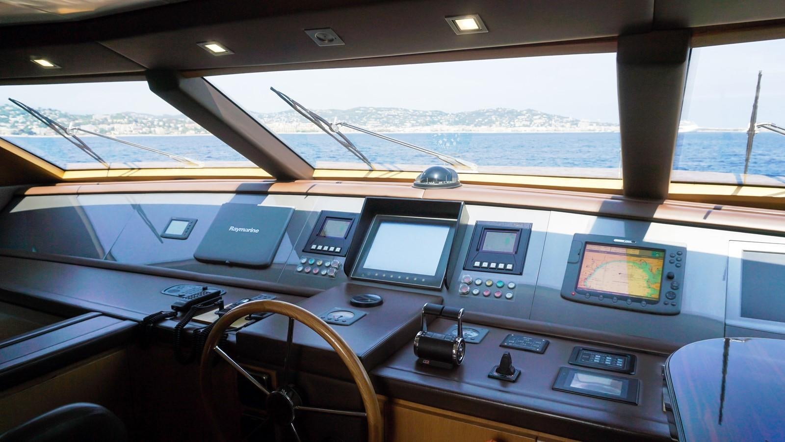 a control panel with monitors and laptops aboard PETRUS Yacht for Sale
