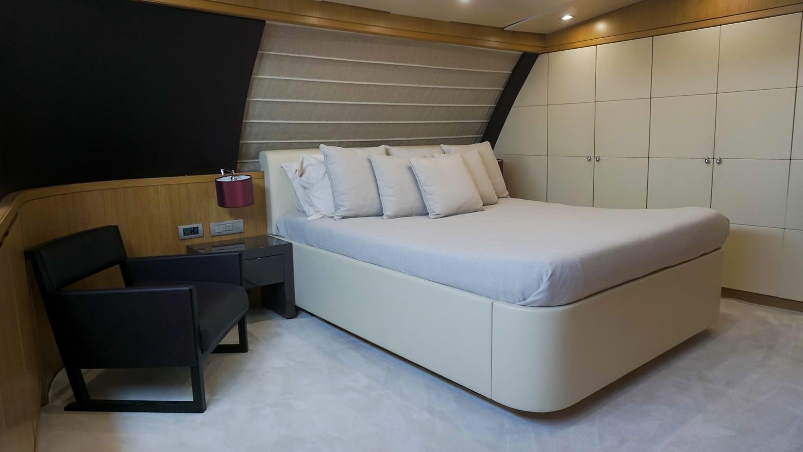 a bed with a white bed aboard PETRUS Yacht for Sale
