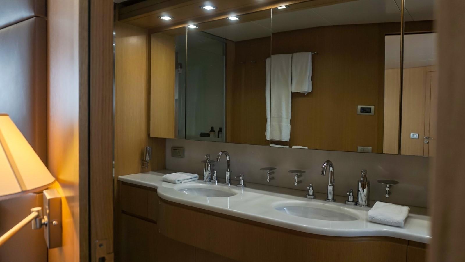 a bathroom with a large mirror aboard PETRUS Yacht for Sale