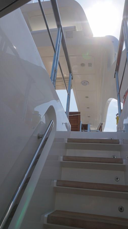 a staircase with a metal railing aboard PETRUS Yacht for Sale