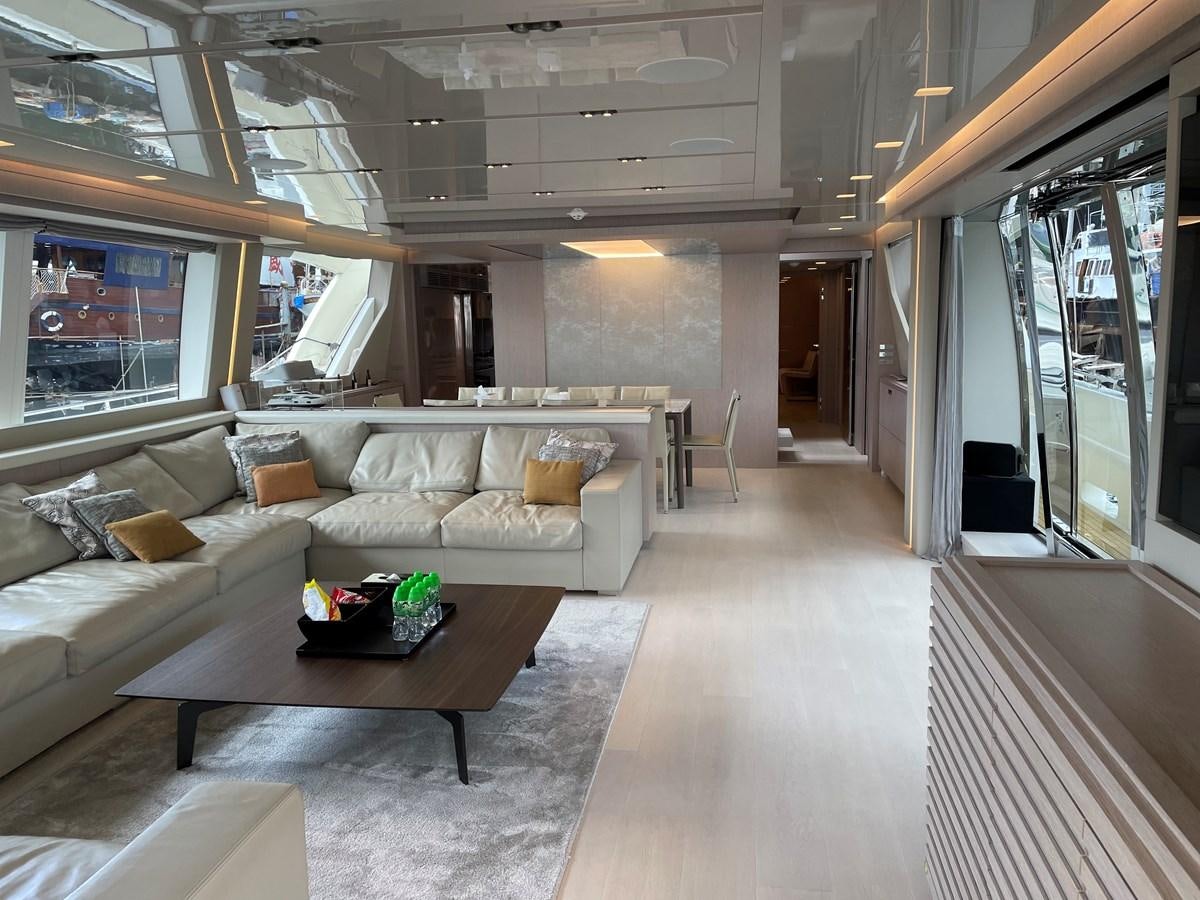 a living room with a couch and a coffee table aboard CUSTOM LINE 108 Yacht for Sale
