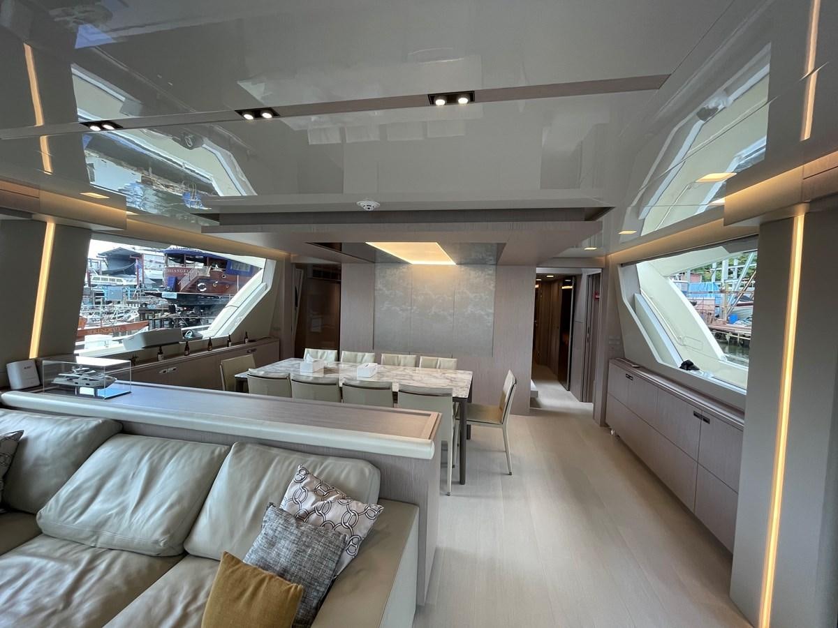 a room with a couch and a television aboard CUSTOM LINE 108 Yacht for Sale