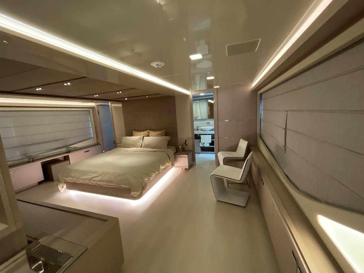 a room with a bed and a window aboard CUSTOM LINE 108 Yacht for Sale
