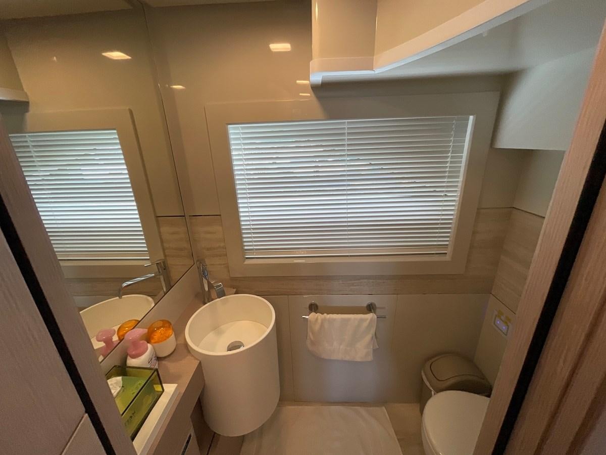 a bathroom with a sink and toilet aboard CUSTOM LINE 108 Yacht for Sale