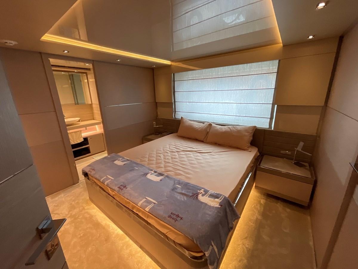 a bedroom with a bed aboard CUSTOM LINE 108 Yacht for Sale