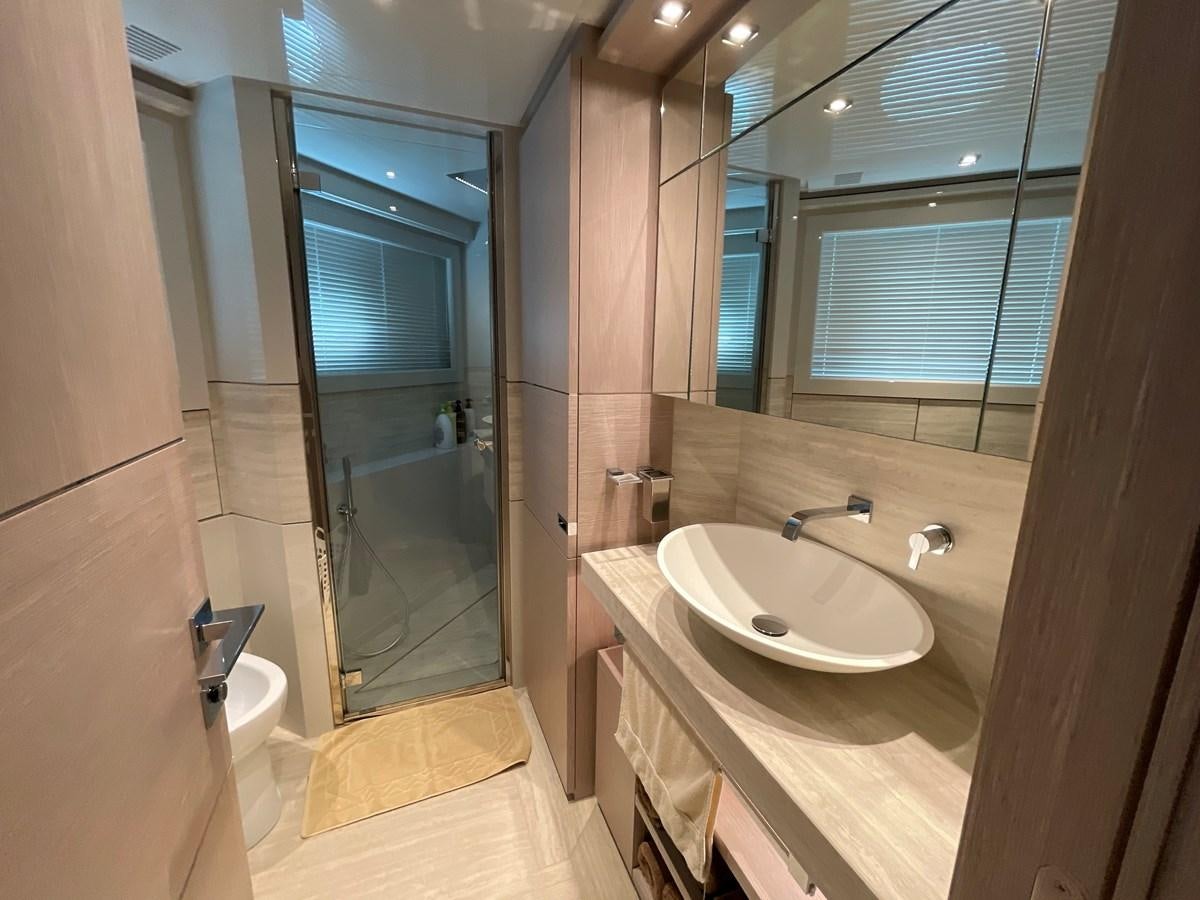 a bathroom with a sink and a shower aboard CUSTOM LINE 108 Yacht for Sale