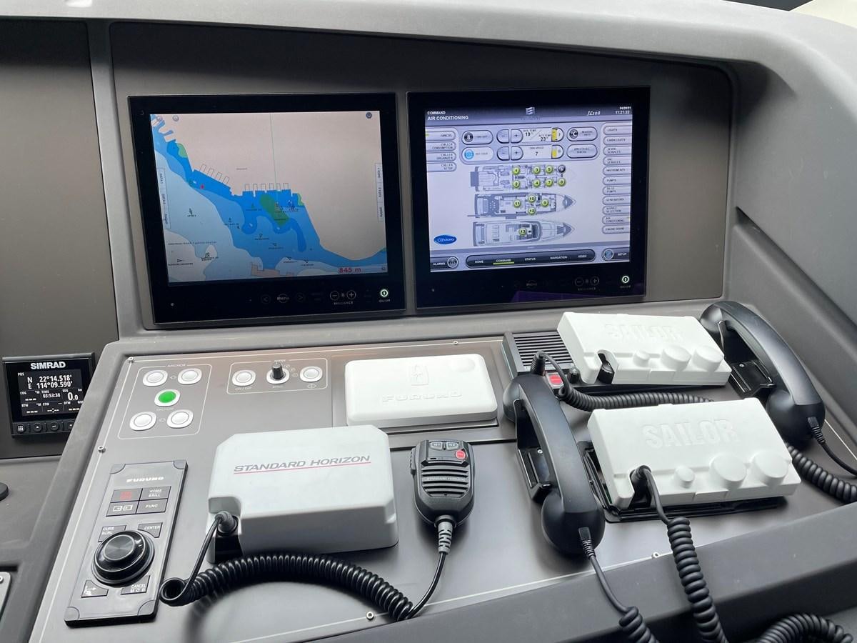 a computer with a screen and other electronics on it aboard CUSTOM LINE 108 Yacht for Sale
