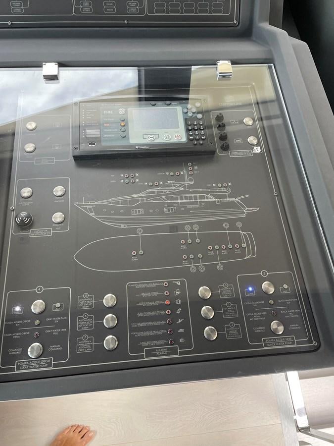a black electronic device aboard CUSTOM LINE 108 Yacht for Sale