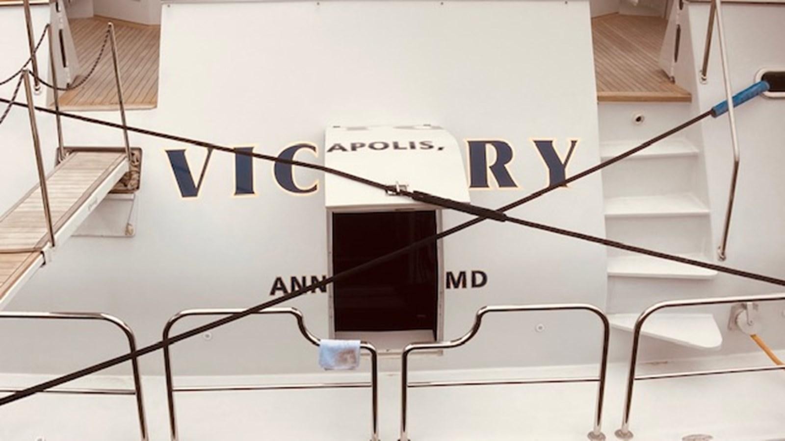 a white board with a black and blue logo on it aboard VICTORY Yacht for Sale