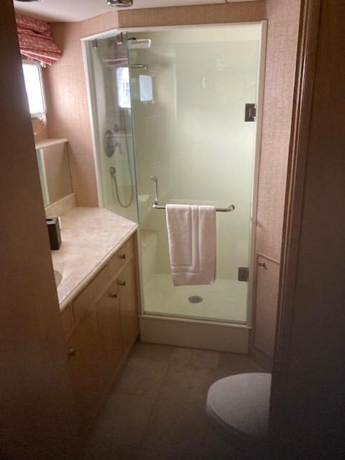 a bathroom with a shower and sink aboard VICTORY Yacht for Sale