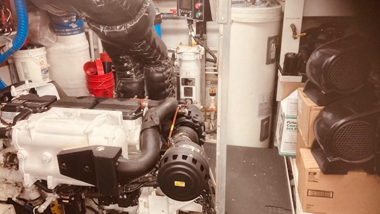 a car engine with a white cylinder aboard VICTORY Yacht for Sale