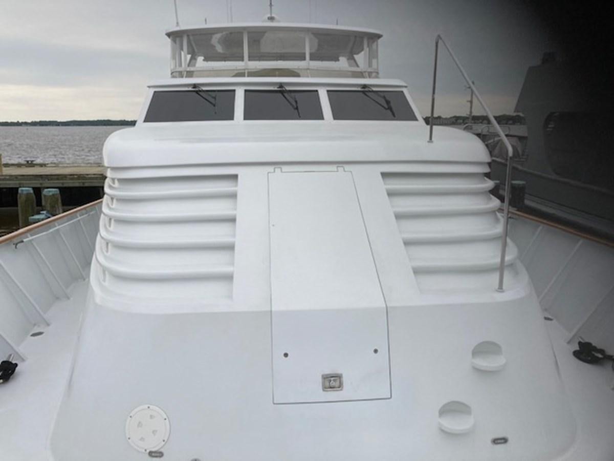 a white boat on a deck aboard VICTORY Yacht for Sale