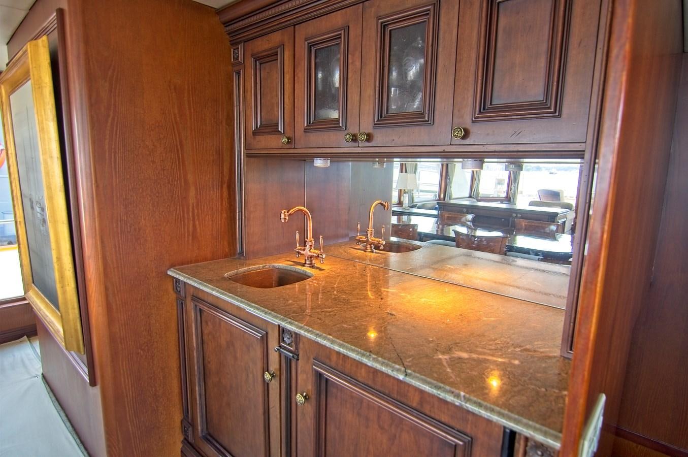 a kitchen with a sink and cabinets aboard VICTORY Yacht for Sale