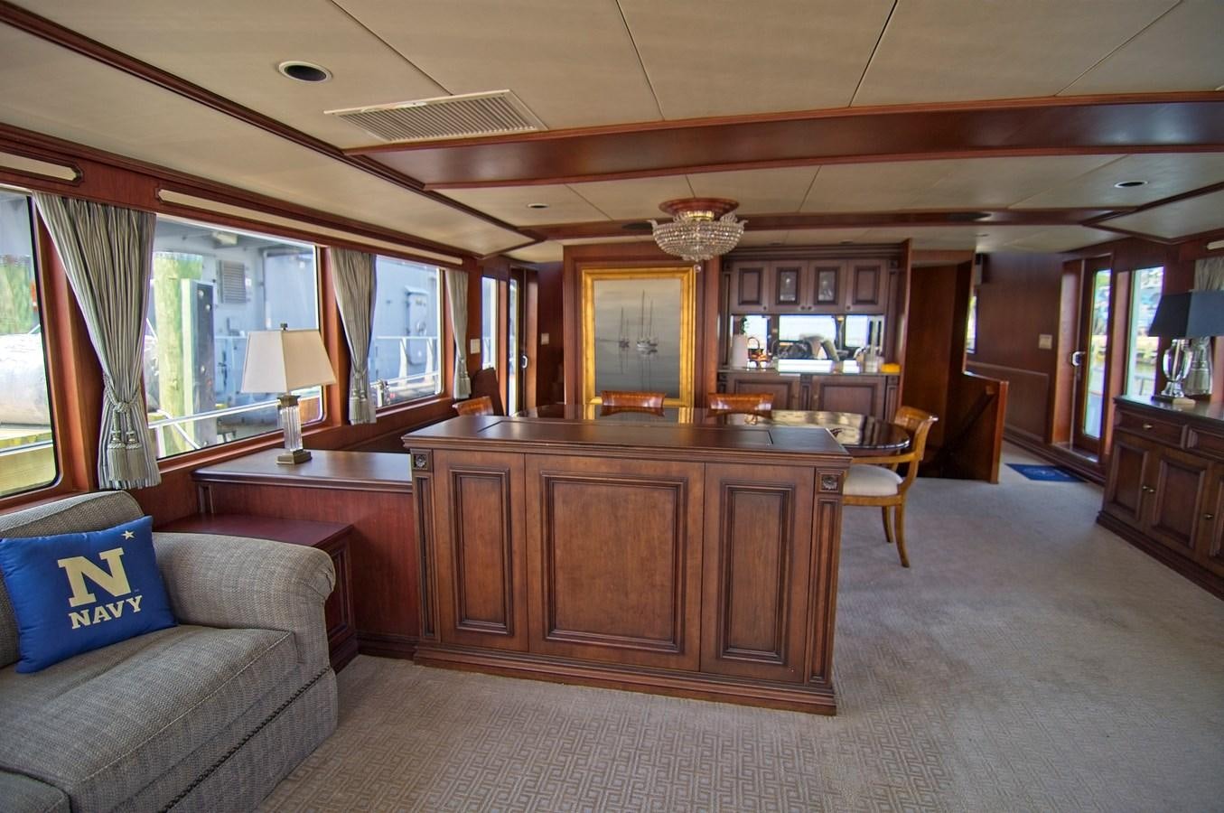 a living room with a large bar and a couch aboard VICTORY Yacht for Sale