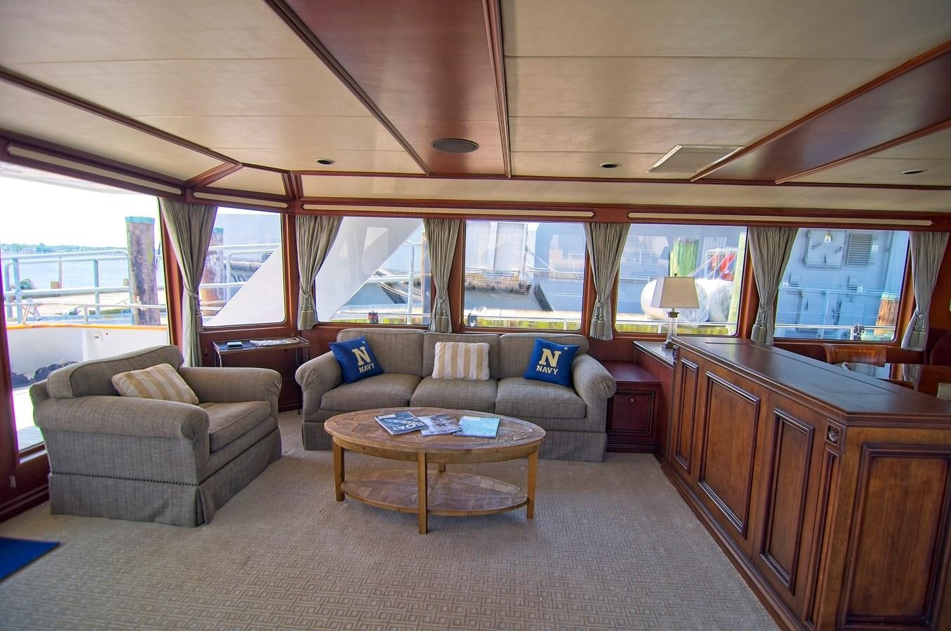 a living room with a couch and a coffee table aboard VICTORY Yacht for Sale