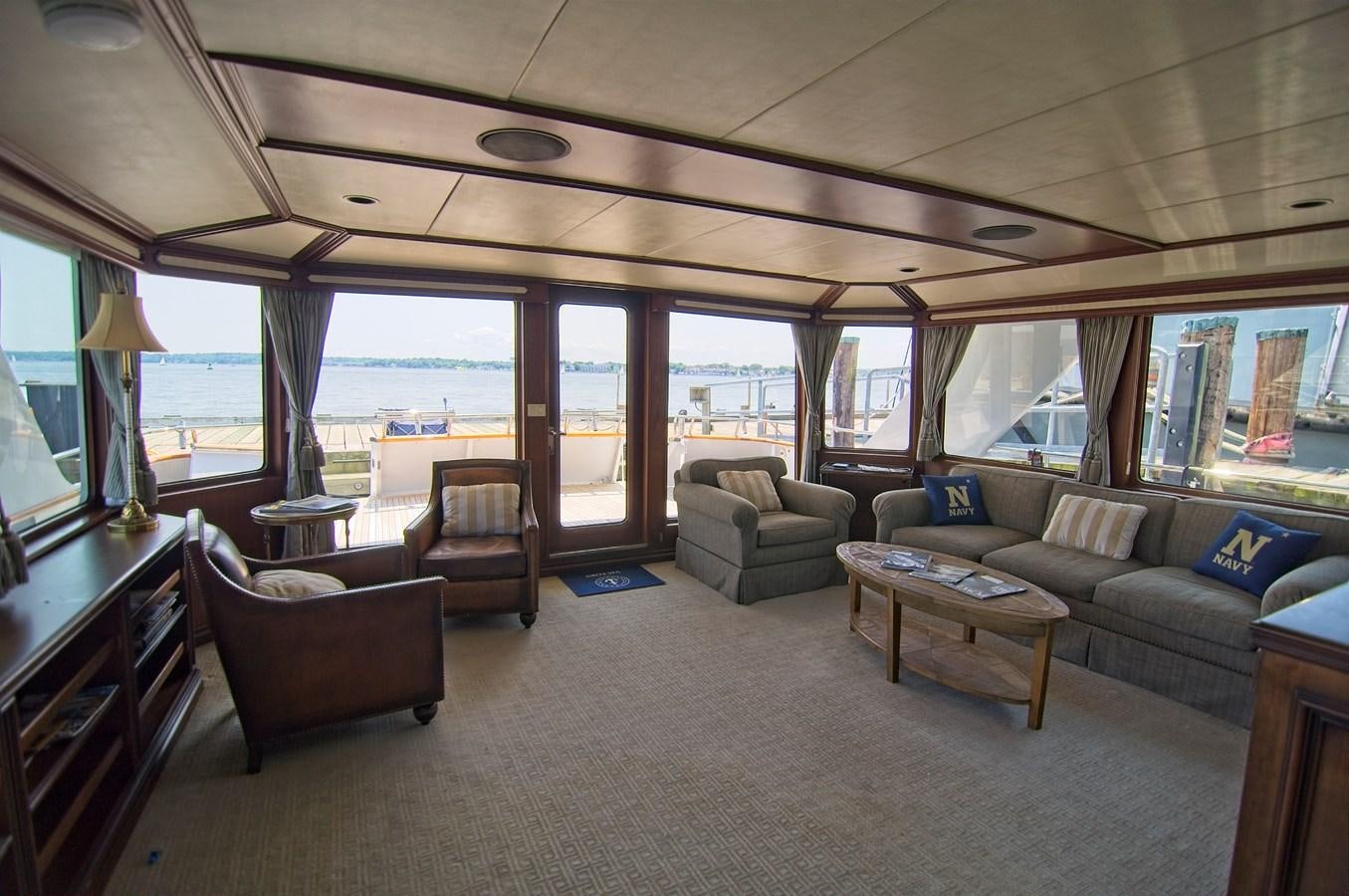 a living room with a large window aboard VICTORY Yacht for Sale