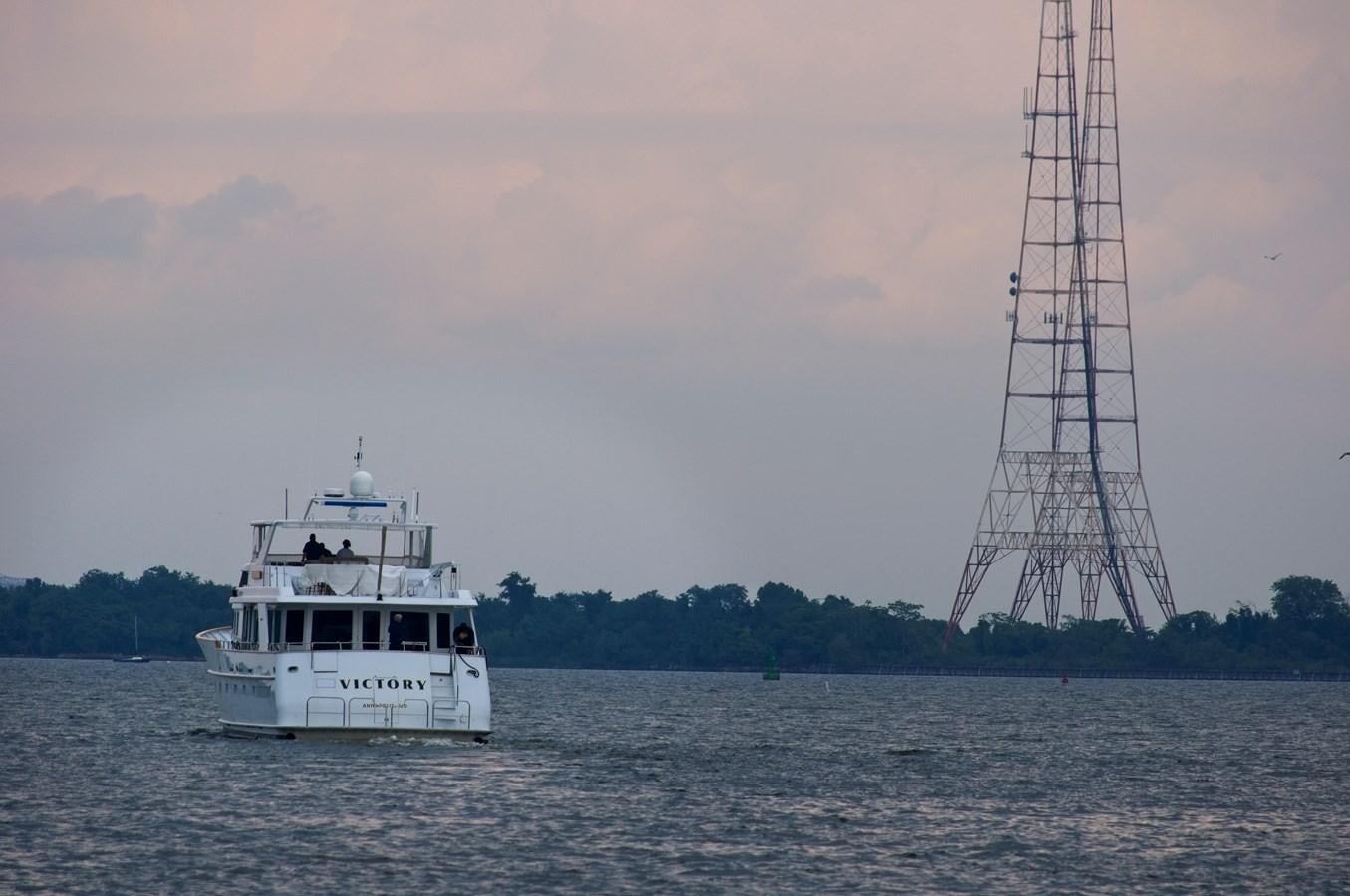 a boat sailing on the water aboard VICTORY Yacht for Sale