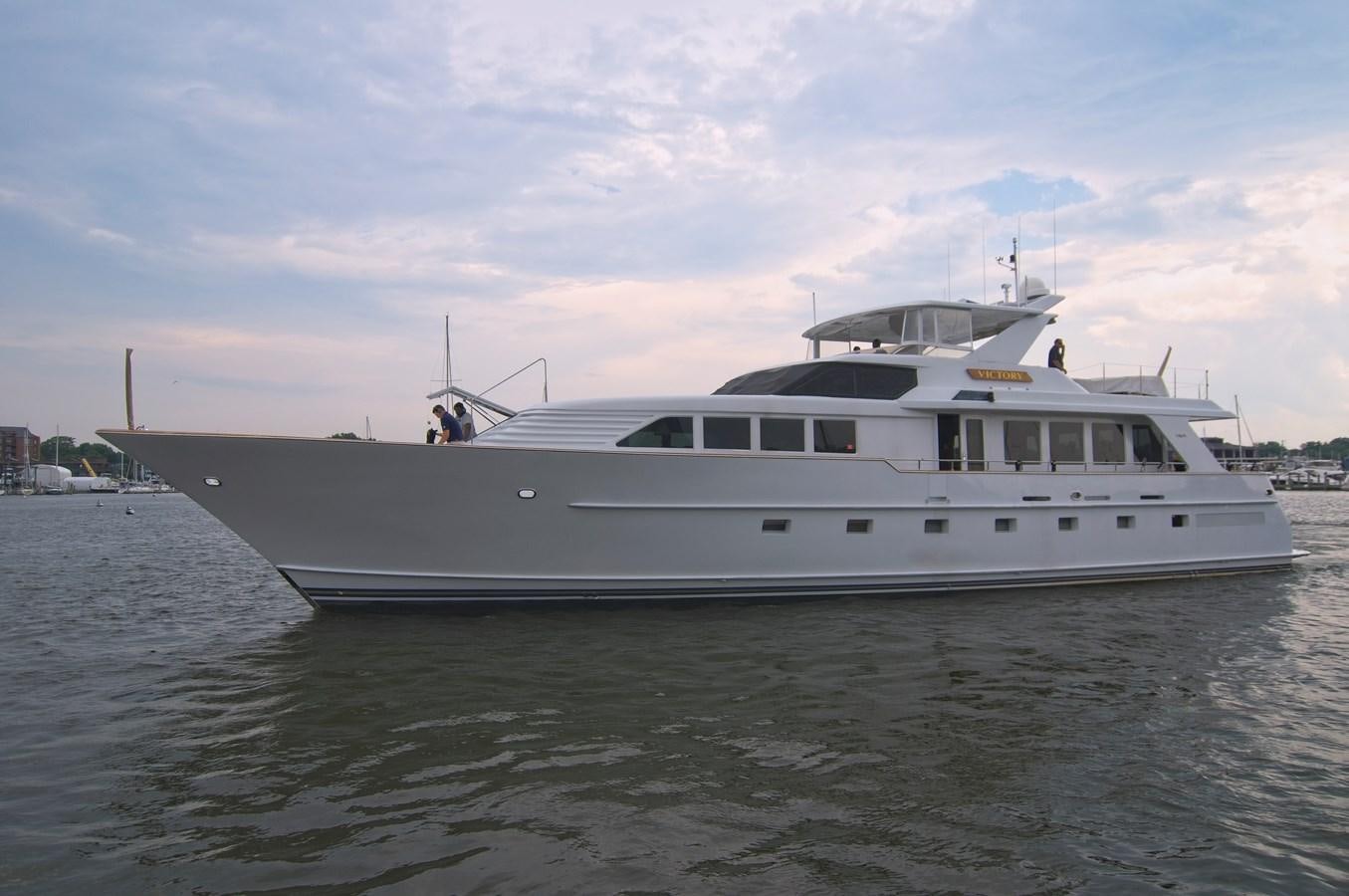 a white yacht on the water aboard VICTORY Yacht for Sale
