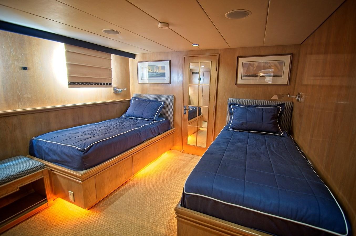 a room with a bed and a couch aboard VICTORY Yacht for Sale