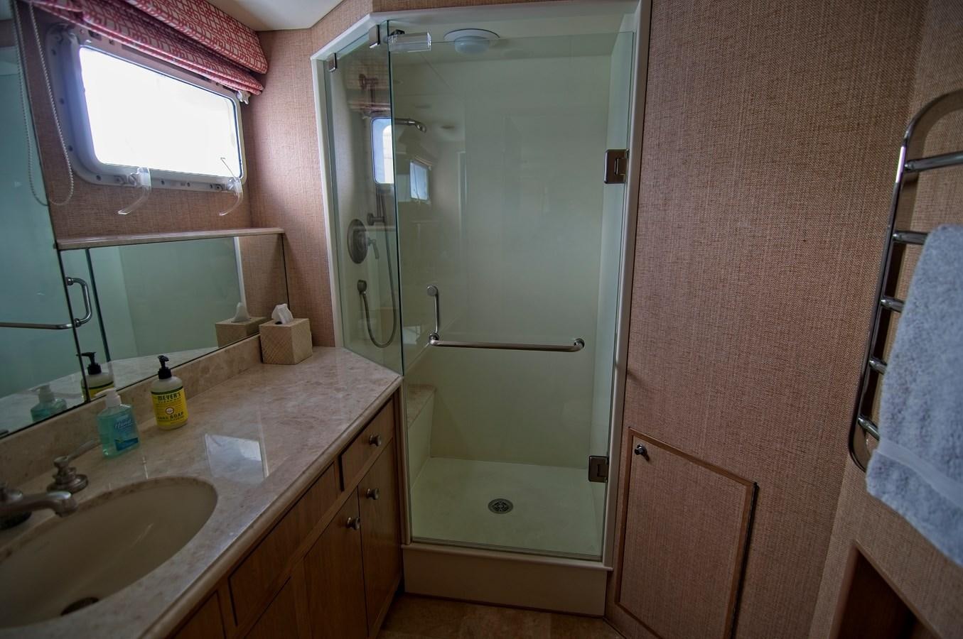 a bathroom with a shower and sink aboard VICTORY Yacht for Sale