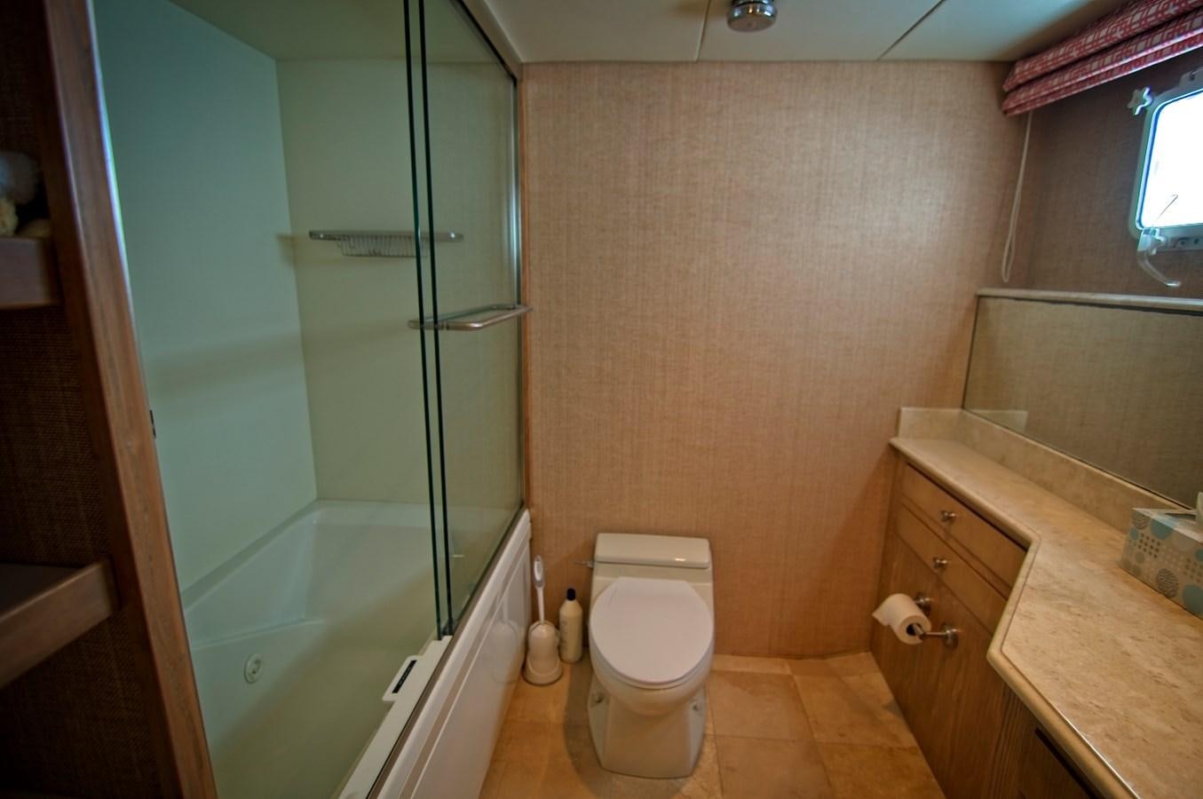 a bathroom with a glass shower aboard VICTORY Yacht for Sale