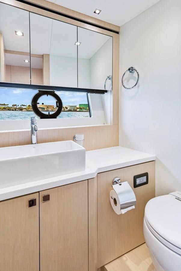 a bathroom with a sink and a mirror aboard SUNSEEKER PREDATOR Yacht for Sale