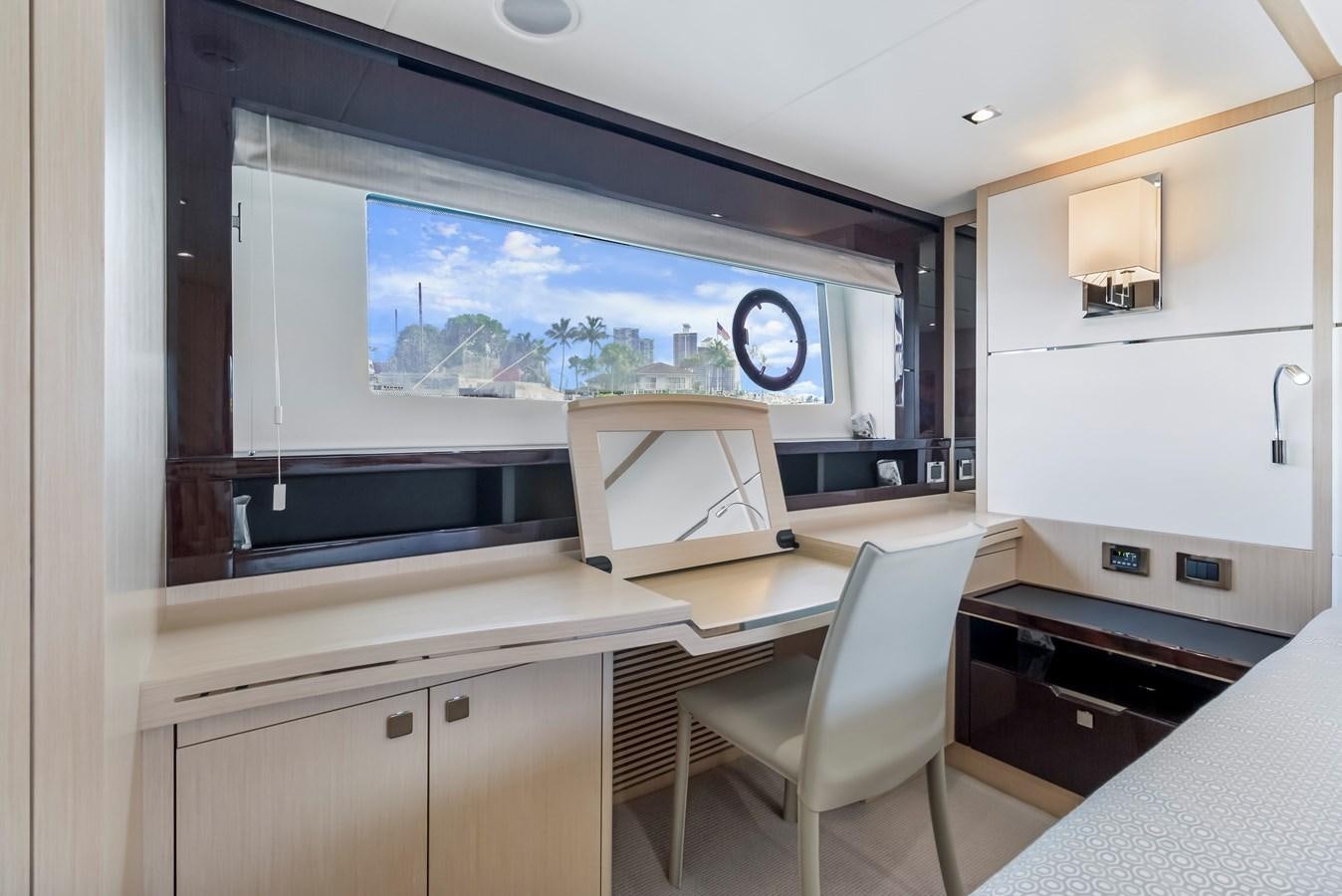 a room with a desk and a tv aboard SUNSEEKER PREDATOR Yacht for Sale