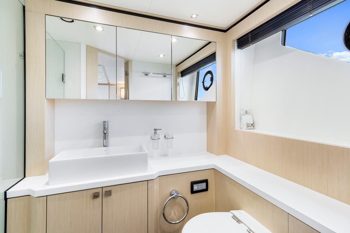 a bathroom with a large mirror aboard SUNSEEKER PREDATOR Yacht for Sale