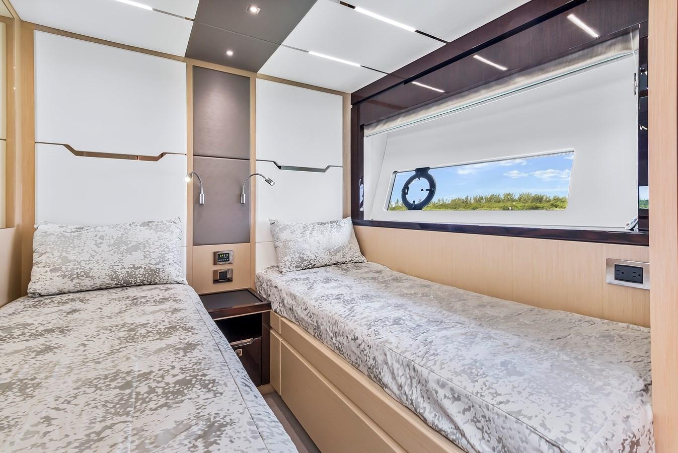a room with two beds aboard SUNSEEKER PREDATOR Yacht for Sale