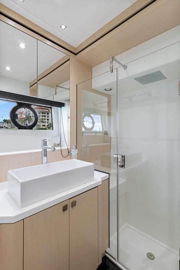 a bathroom with a sink and a shower unit aboard SUNSEEKER PREDATOR Yacht for Sale