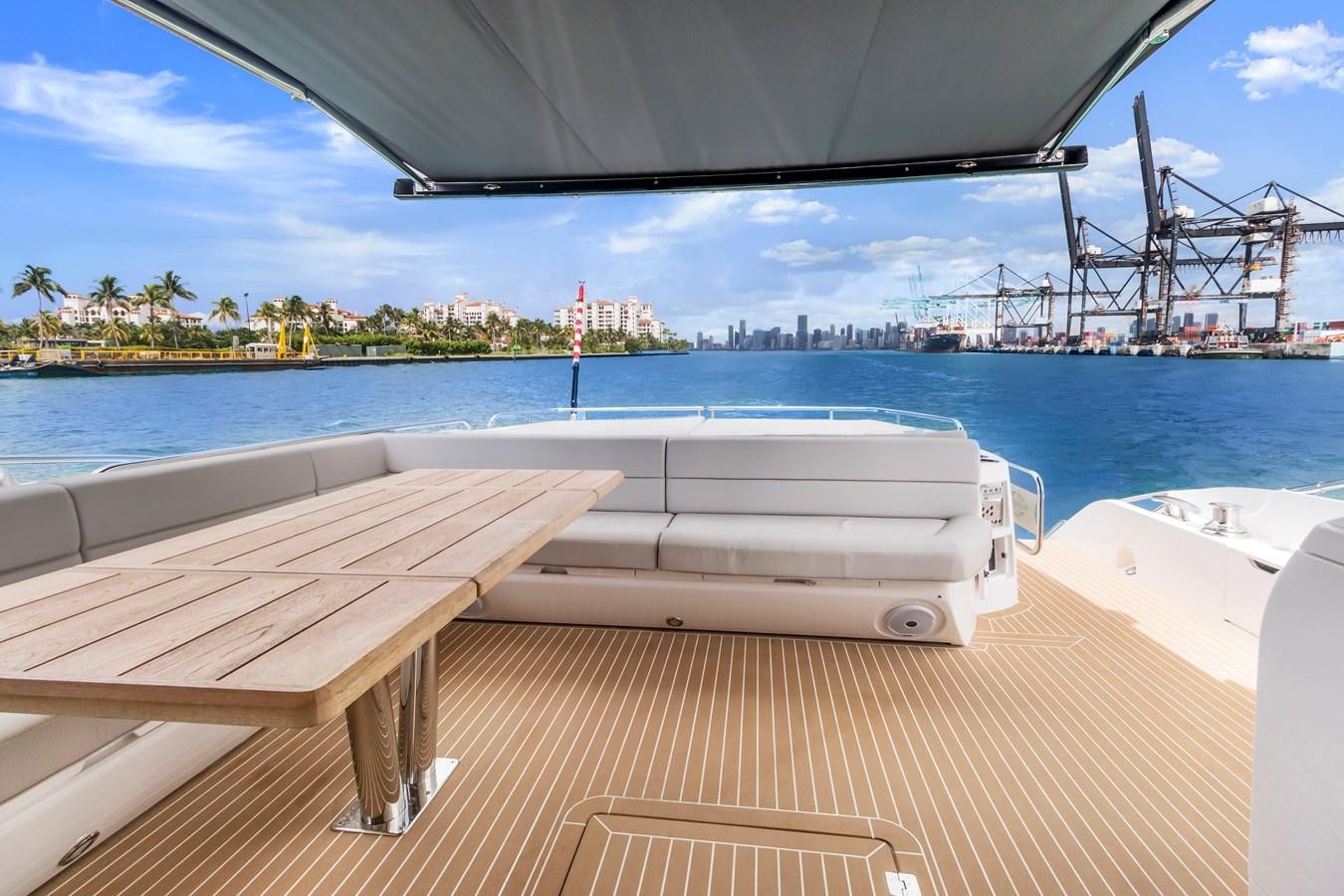 a deck with a view of a city and water aboard SUNSEEKER PREDATOR Yacht for Sale