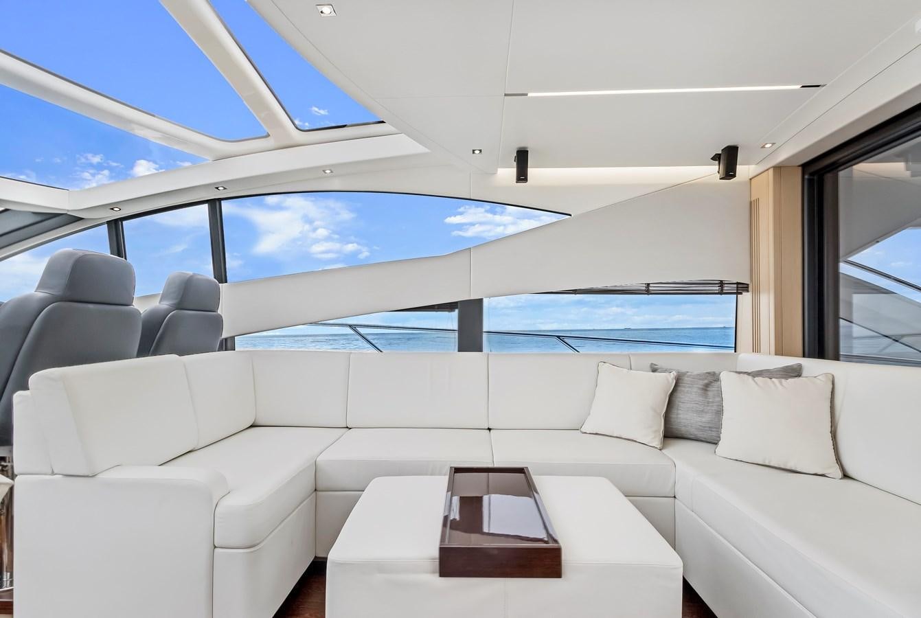 a white couch in a room aboard SUNSEEKER PREDATOR Yacht for Sale