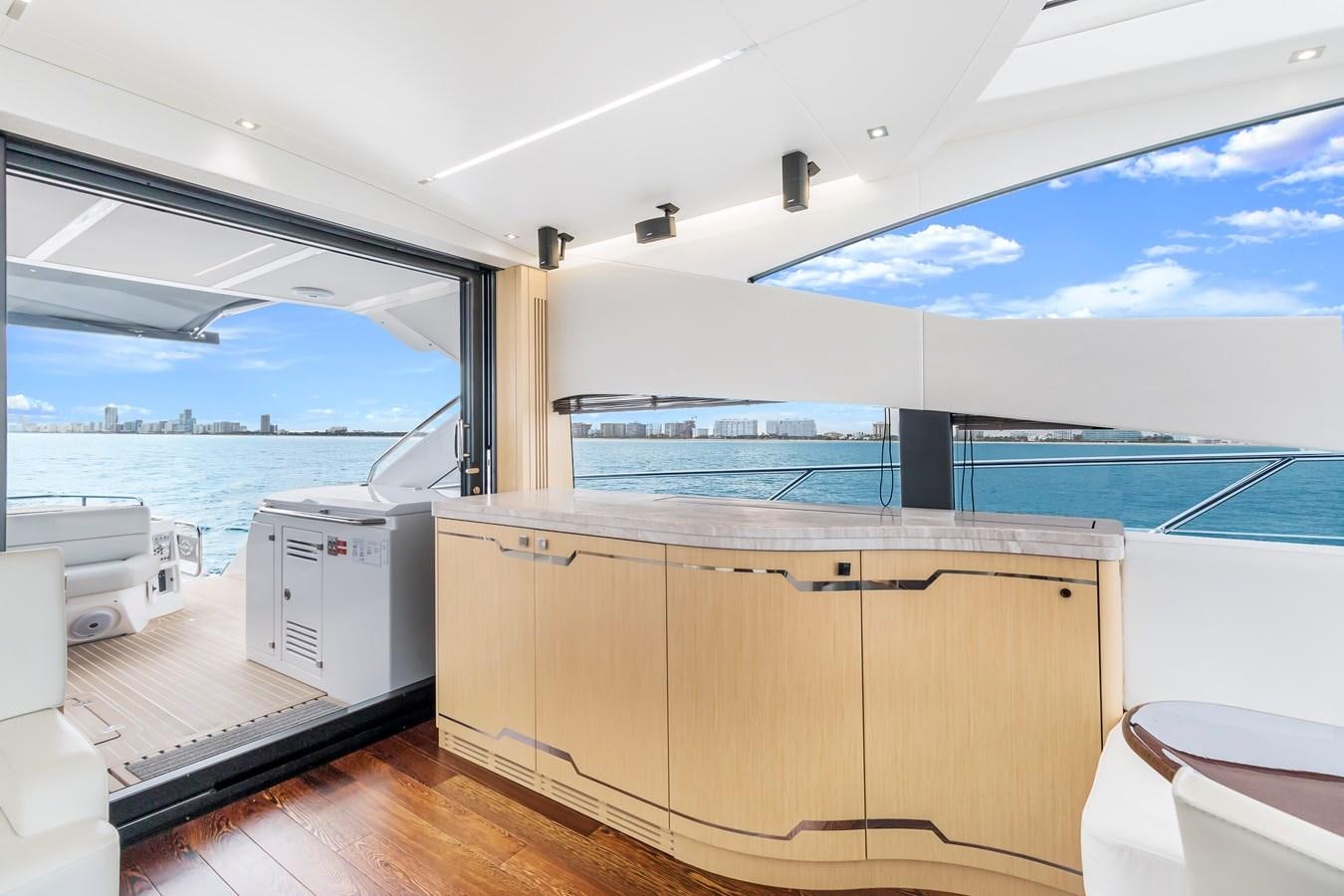 a room with a large window and a view of the water aboard SUNSEEKER PREDATOR Yacht for Sale