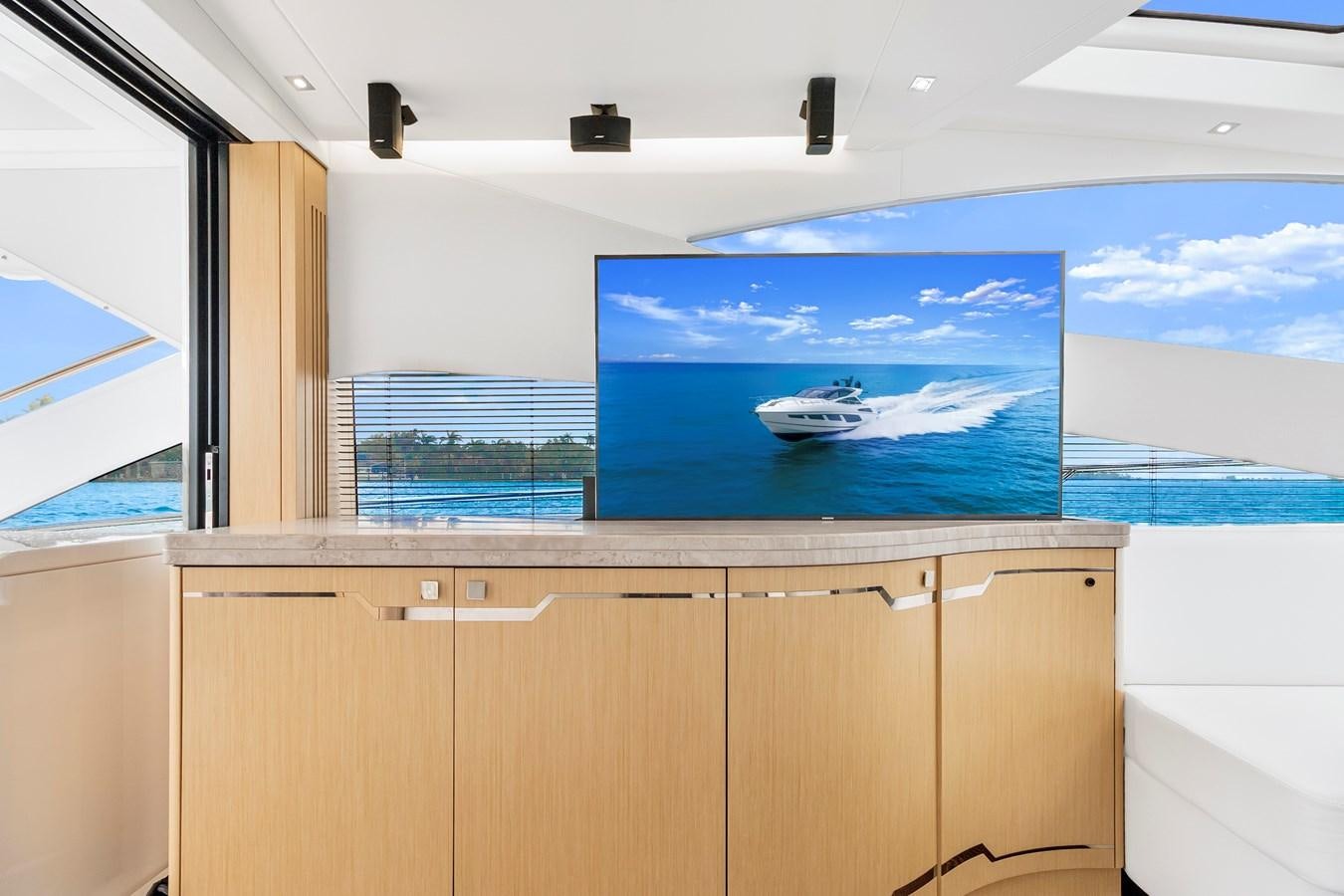 a room with a large screen aboard SUNSEEKER PREDATOR Yacht for Sale