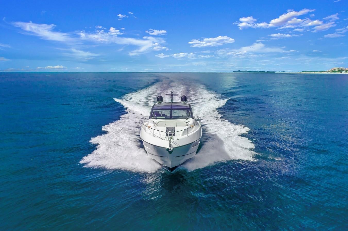 a boat on the water aboard SUNSEEKER PREDATOR Yacht for Sale