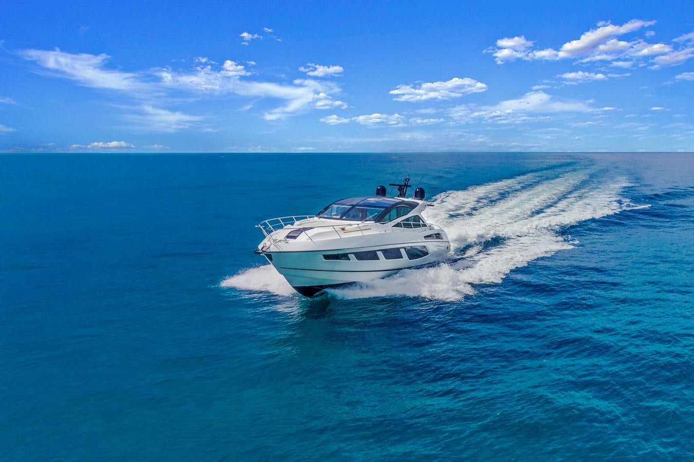 a white yacht on the water aboard SUNSEEKER PREDATOR Yacht for Sale