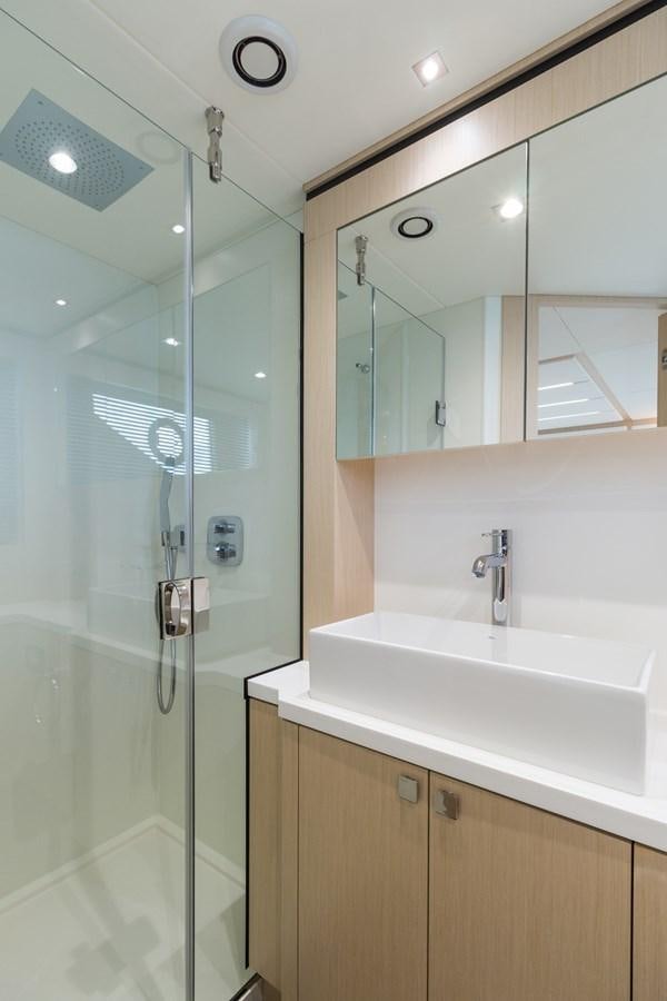 a bathroom with a glass shower aboard SUNSEEKER PREDATOR Yacht for Sale