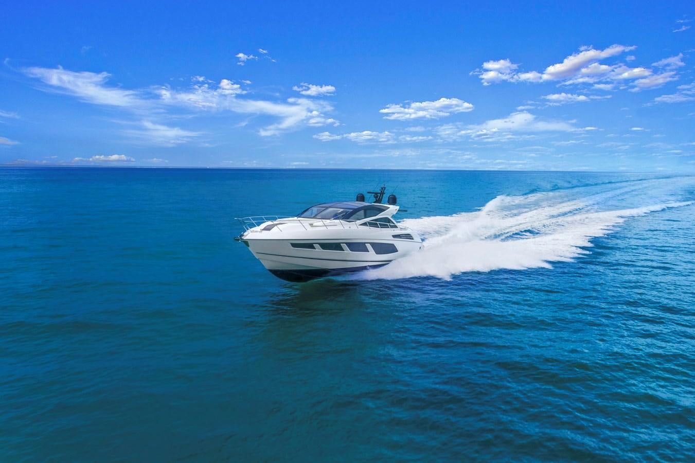 a white yacht on the water aboard SUNSEEKER PREDATOR Yacht for Sale