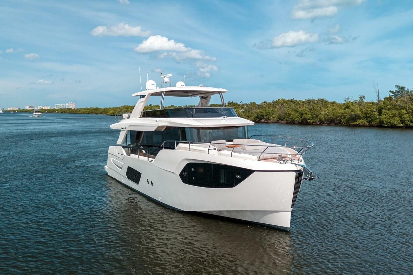 a white boat on the water aboard NAVETTA 68 Yacht for Sale