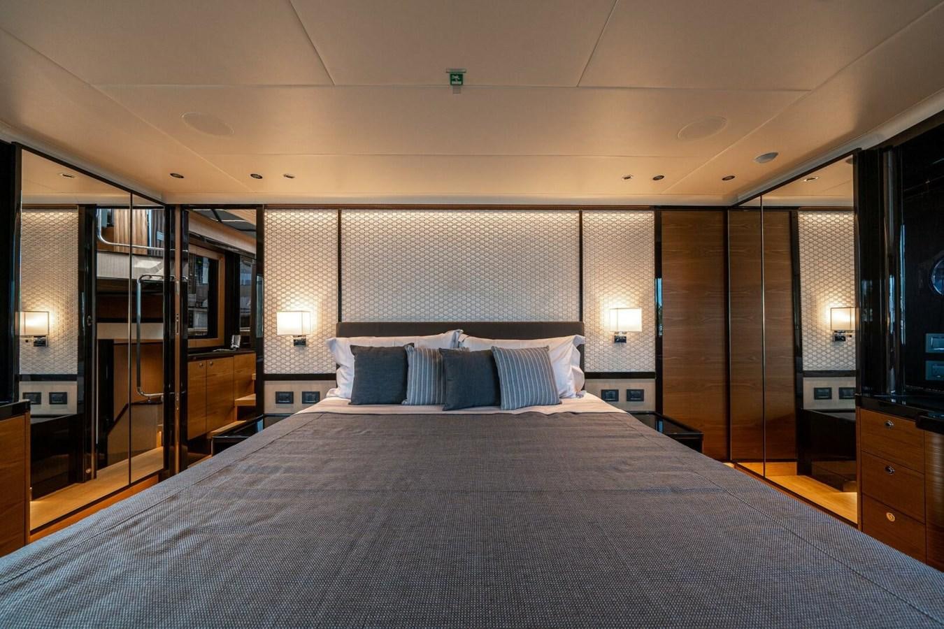 a large bed in a hotel room aboard NAVETTA 68 Yacht for Sale