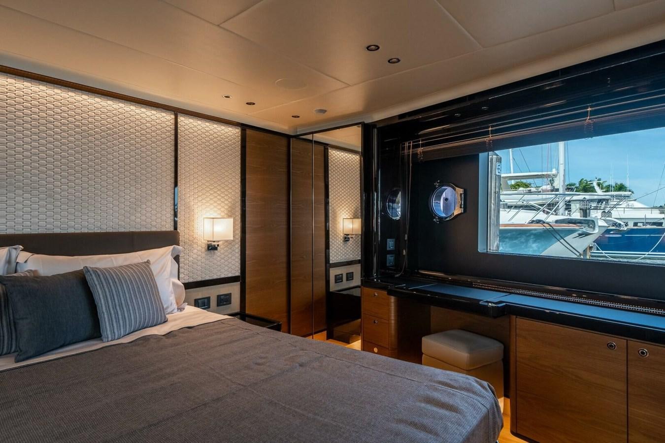 a bedroom with a large bed aboard NAVETTA 68 Yacht for Sale