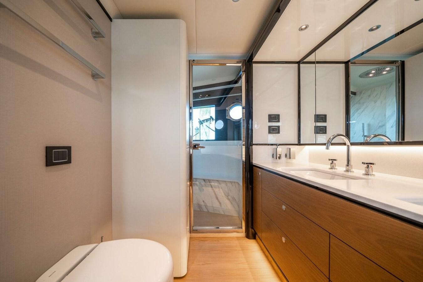 a bathroom with a sink and a mirror aboard NAVETTA 68 Yacht for Sale