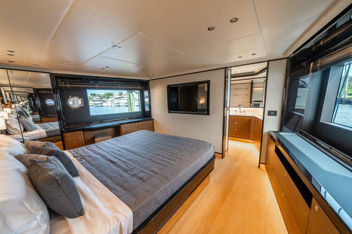 a bedroom with a large bed aboard NAVETTA 68 Yacht for Sale