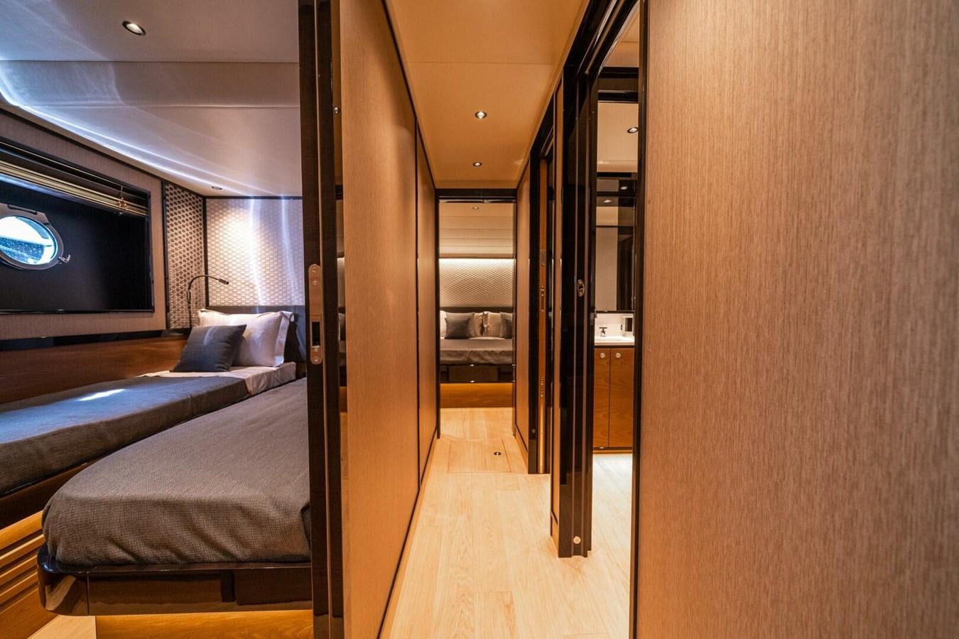 a room with a bed and a door aboard NAVETTA 68 Yacht for Sale