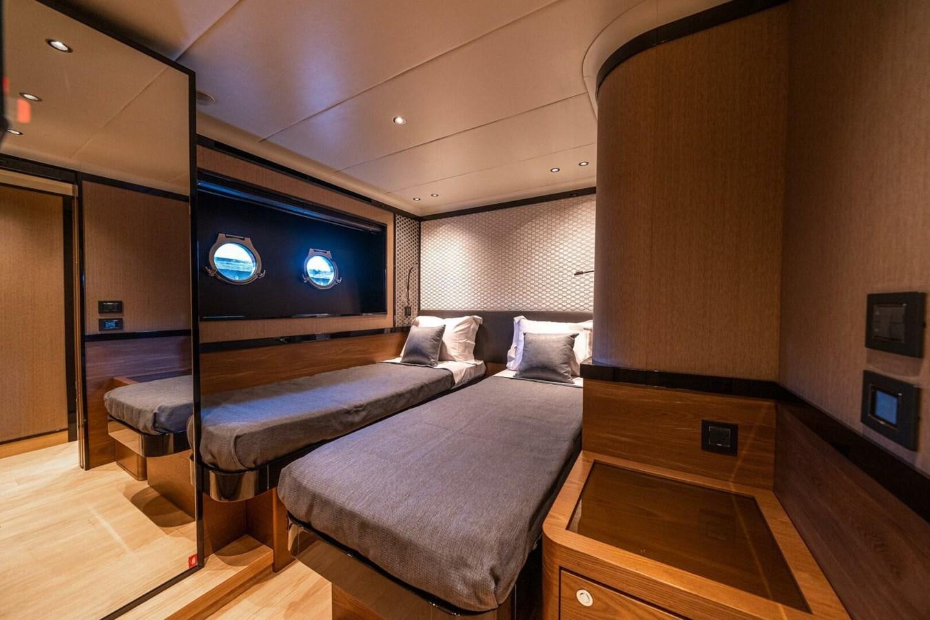 a bed in a room aboard NAVETTA 68 Yacht for Sale