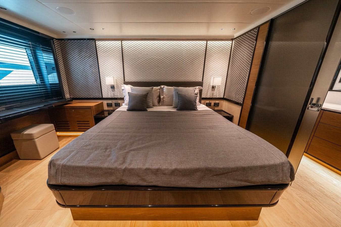 a bed in a room aboard NAVETTA 68 Yacht for Sale