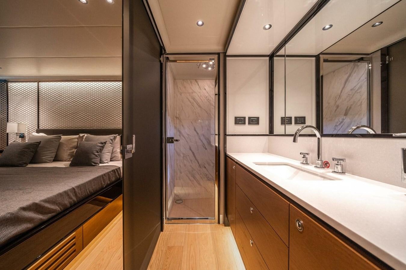 a bedroom with a bed and a sink aboard NAVETTA 68 Yacht for Sale