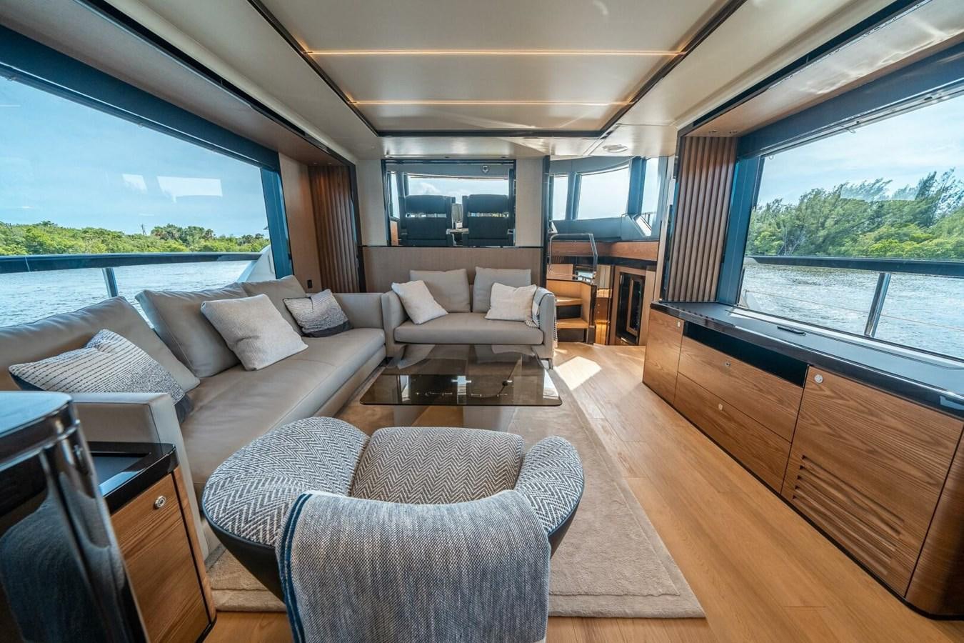 a living room with a large window aboard NAVETTA 68 Yacht for Sale