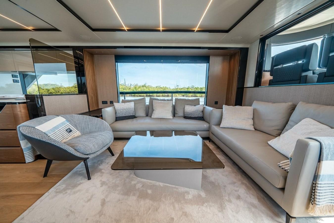 a living room with a large window aboard NAVETTA 68 Yacht for Sale